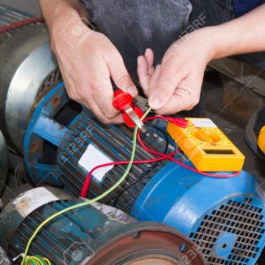 repairman during maintenance work of electric motors